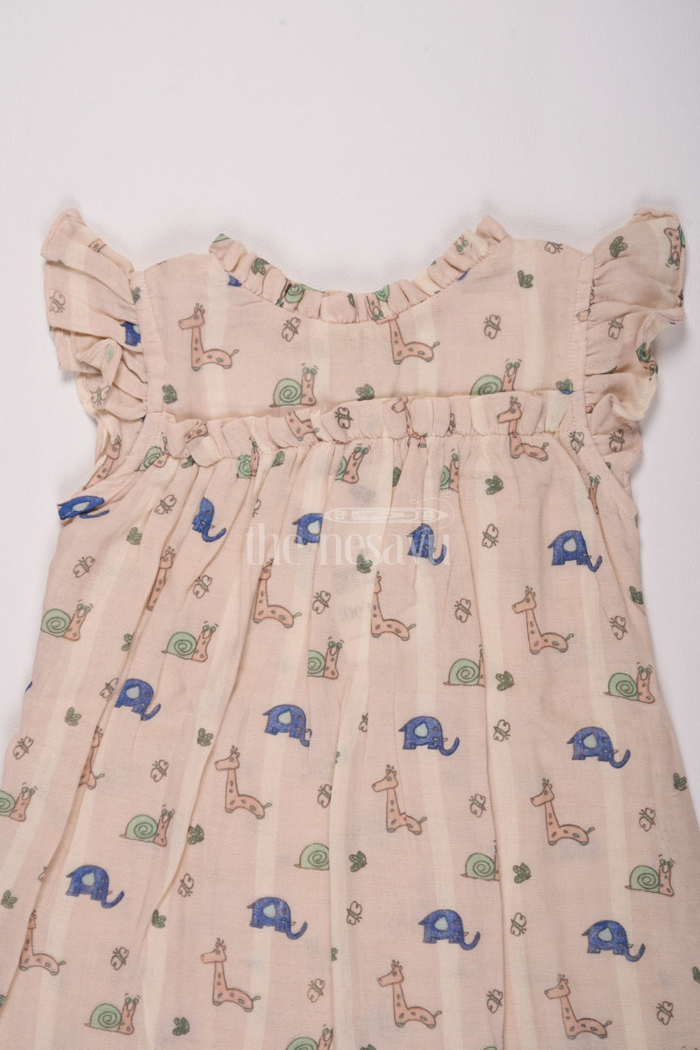 The Nesavu Girls Cotton Frock Girls Cotton Frock Ka Design Featuring Snail and Giraffe Print in Muslin Fabric Nesavu Nesavu Girls Cotton Frock Ka Design Muslin Snail Giraffe Print Playdates