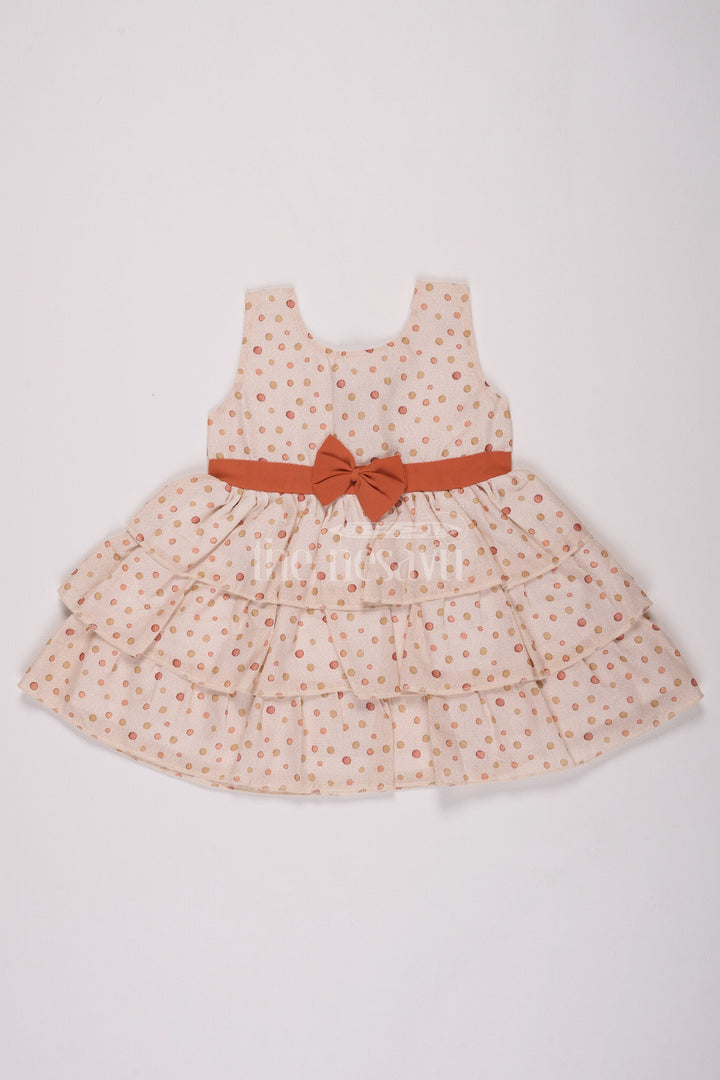 The Nesavu Baby Cotton Frocks Girls Cream Brasso Polka Dot Dress with Rust Bow and Layered Skirt for Festive Gatherings Nesavu 14 (6M) / Cream BFJ645B-14 Nesavu Girls Cream Brasso Dress Gold Polka Dots Layered Skirt Festive Events