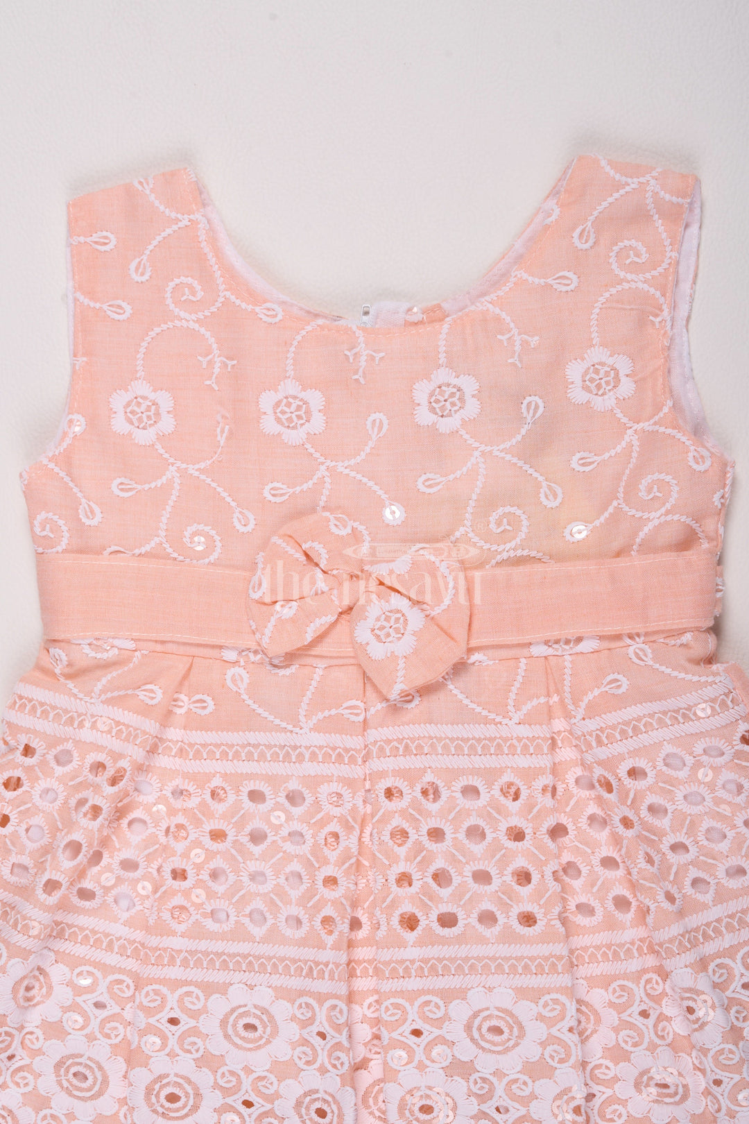 The Nesavu Baby Cotton Frocks Girls Peach Cotton Embroidered Frock with Floral Design and Bow Detail for Celebrations Nesavu Nesavu Girls Peach Cotton Frock Floral Embroidery Bow Special Celebrations