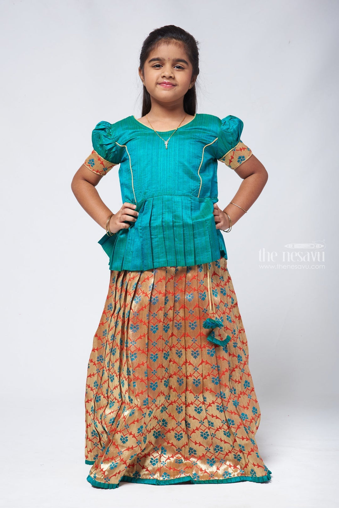 The Nesavu Pattu Pavadai Gorgeous Green Silk Peplum Blouse paired with Zari Floral Pattu Pavadai: Authentic South Indian Elegance Nesavu 14 (6M) / Blue GPP293C-14 Pattu Pavadai with peplum blouse | Pattu Pavadai with Zari Border | The Nesavu