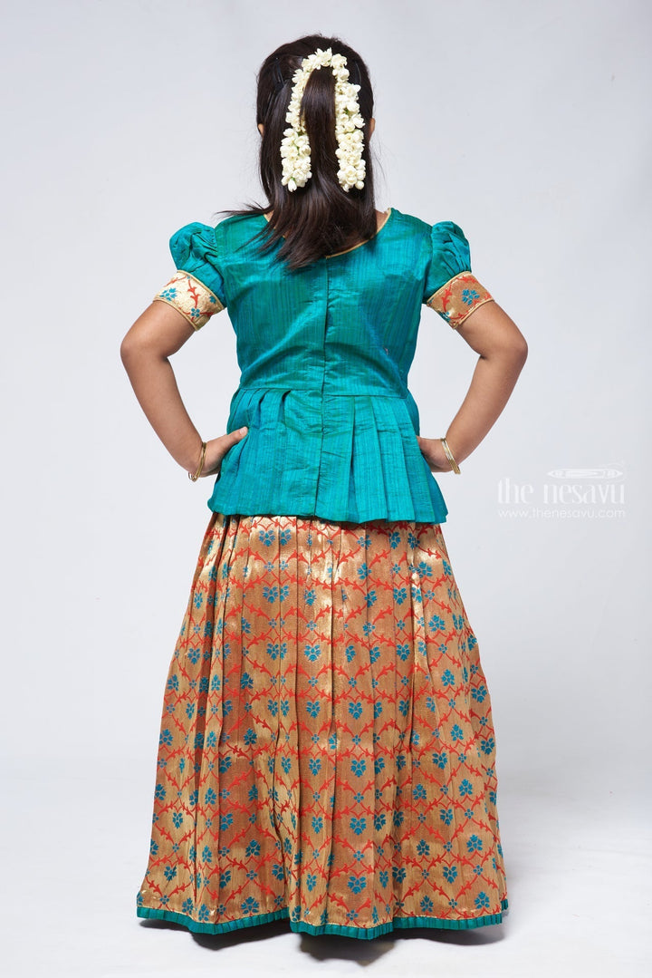 The Nesavu Pattu Pavadai Gorgeous Green Silk Peplum Blouse paired with Zari Floral Pattu Pavadai: Authentic South Indian Elegance Nesavu Pattu Pavadai with peplum blouse | Pattu Pavadai with Zari Border | The Nesavu