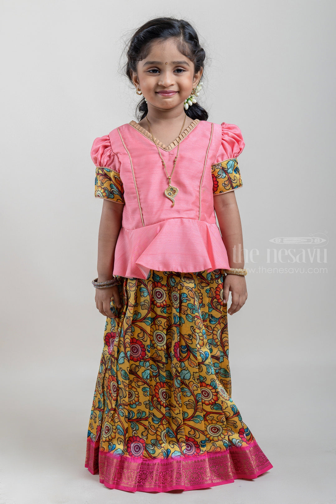 The Nesavu Pattu Pavadai Gorgeous Salmon Pink and Yellow Silk Pattu Pavadai for Girls with Floral Cuffs and Banarasi Border Nesavu Salmon Pink and Yellow Silk Pattu Pavadai for Girls at The Nesavu | Traditional Indian Outfit