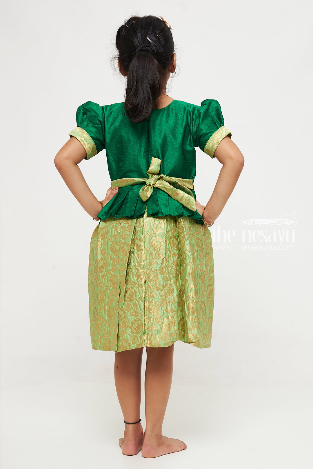 The Nesavu Silk Party Frock Green and Gold Banarasi Semi-Silk Dress for Girls - Perfect for Onam and Navratri Nesavu Green and Gold Banarasi Semi-Silk Dress for Girls - Onam and Navratri