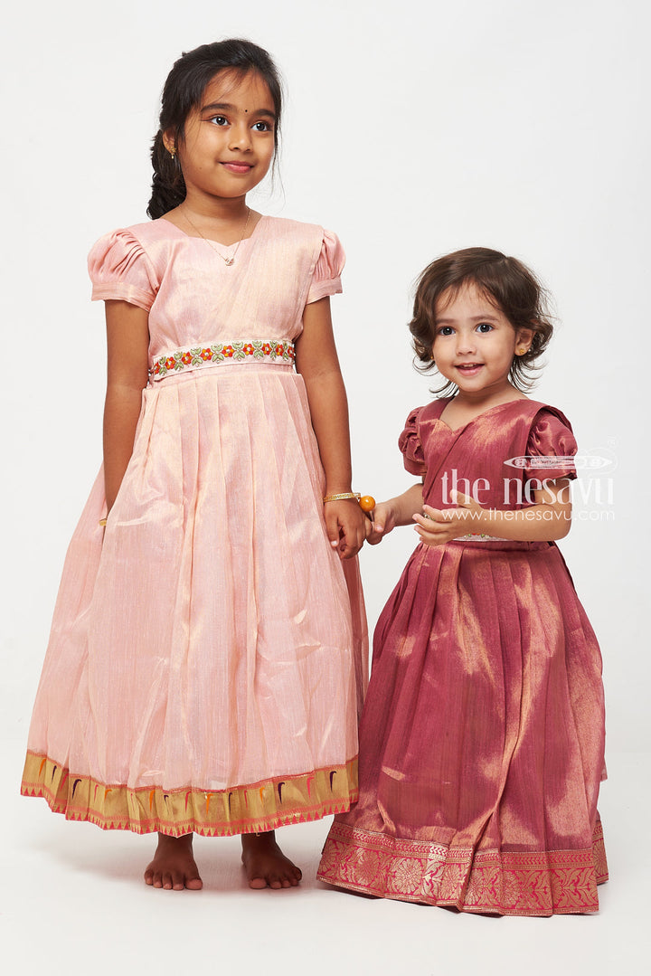 The Nesavu Girls Silk Gown Magenta Tissue Fabric Saree Gown for Girls with Embroidered Hip Belt Nesavu