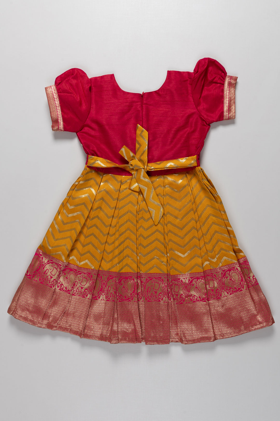 The Nesavu Silk Party Frock Majestic Maroon and Yellow Pattu Silk Frock: Intricate Gold Embroidery with Chevron for Girls Nesavu Maroon and Yellow Pattu Silk Frock | Chevron Pattern & Banarasi Border | Traditional Festive Wear for Girls | The Nesavu