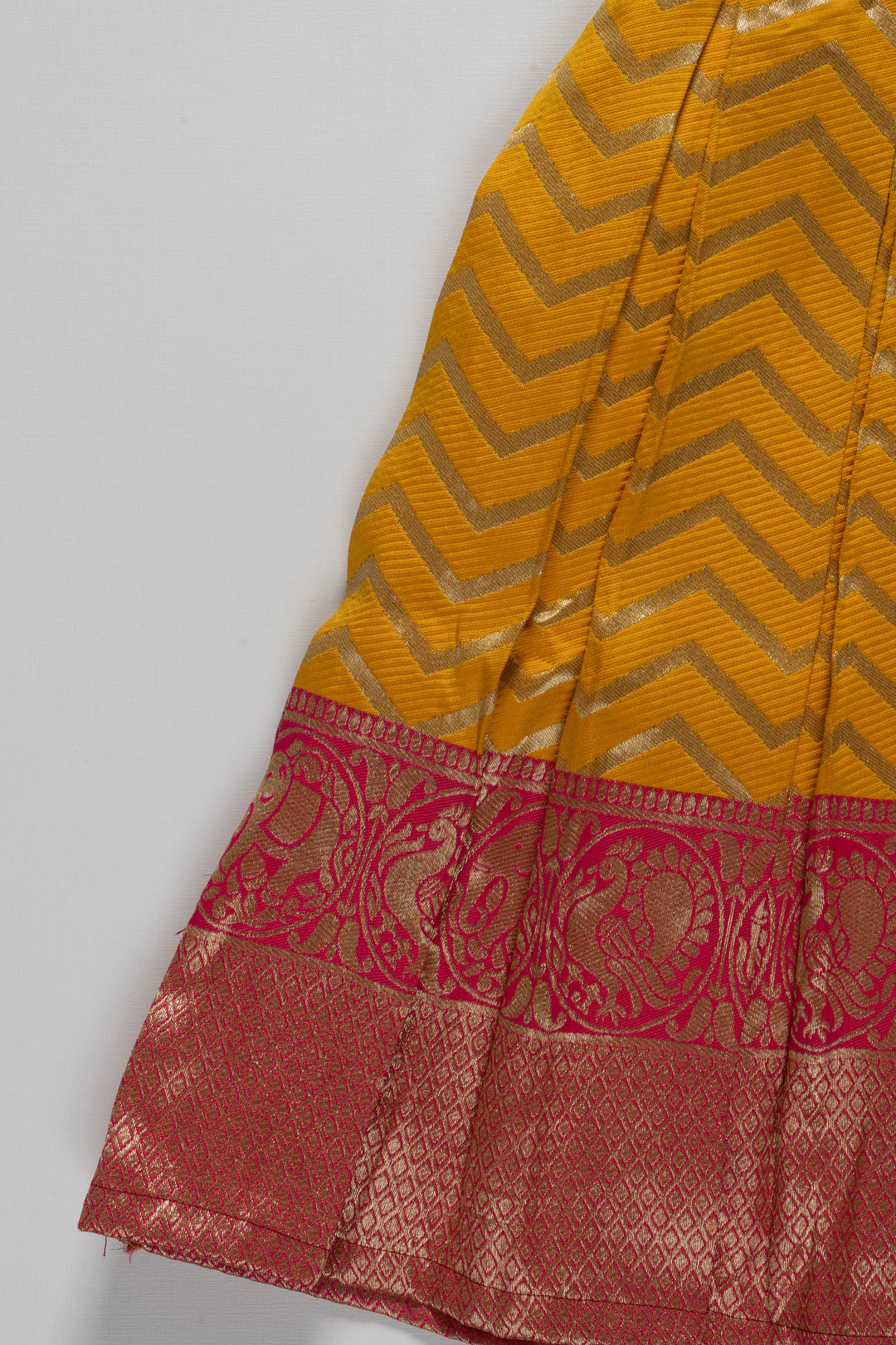 The Nesavu Silk Party Frock Majestic Maroon and Yellow Pattu Silk Frock: Intricate Gold Embroidery with Chevron for Girls Nesavu Maroon and Yellow Pattu Silk Frock | Chevron Pattern & Banarasi Border | Traditional Festive Wear for Girls | The Nesavu