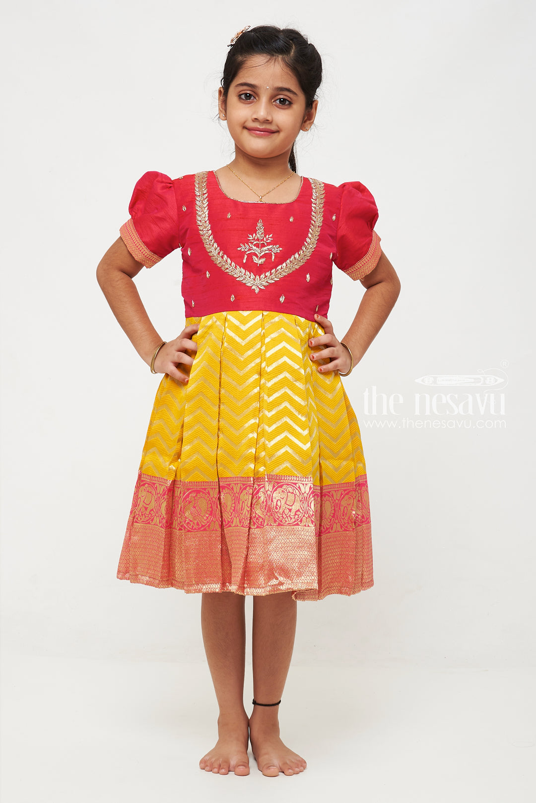 The Nesavu Silk Party Frock Majestic Maroon and Yellow Pattu Silk Frock: Intricate Gold Embroidery with Chevron for Girls Nesavu Maroon and Yellow Pattu Silk Frock | Chevron Pattern & Banarasi Border | Traditional Festive Wear for Girls | The Nesavu