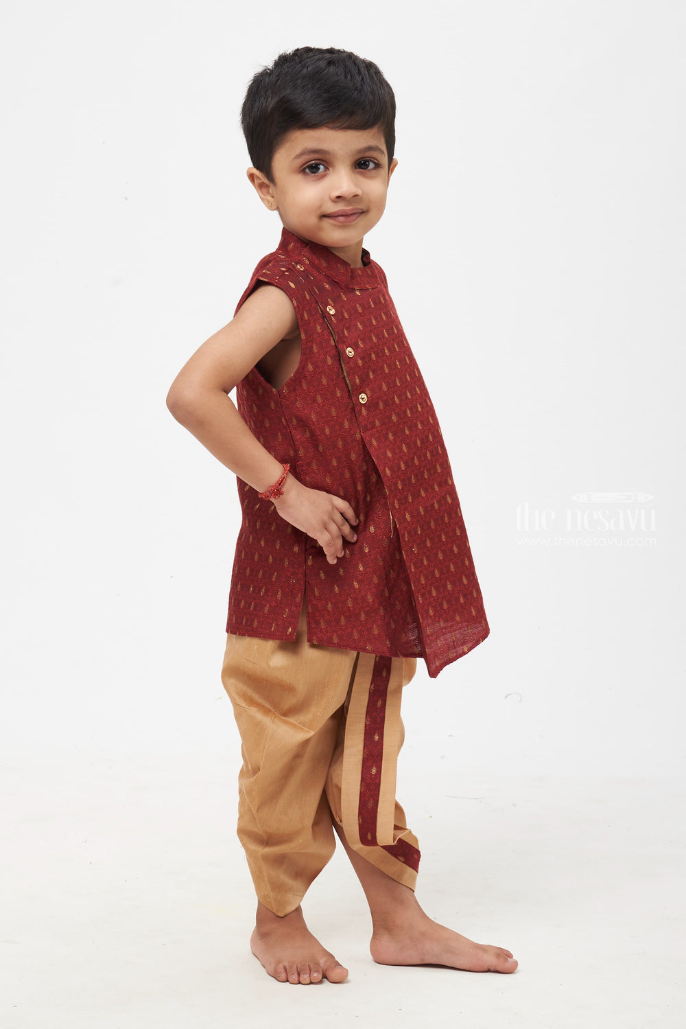 The Nesavu Boys Dothi Set Majestic Maroon Elegance: Boys' Paisley Patterned Vest with Neutral Beige Trousers Nesavu Boys Royal Maroon Kurta with Golden Panchagajam | Timeless Look for Traditional Events | The Nesavu