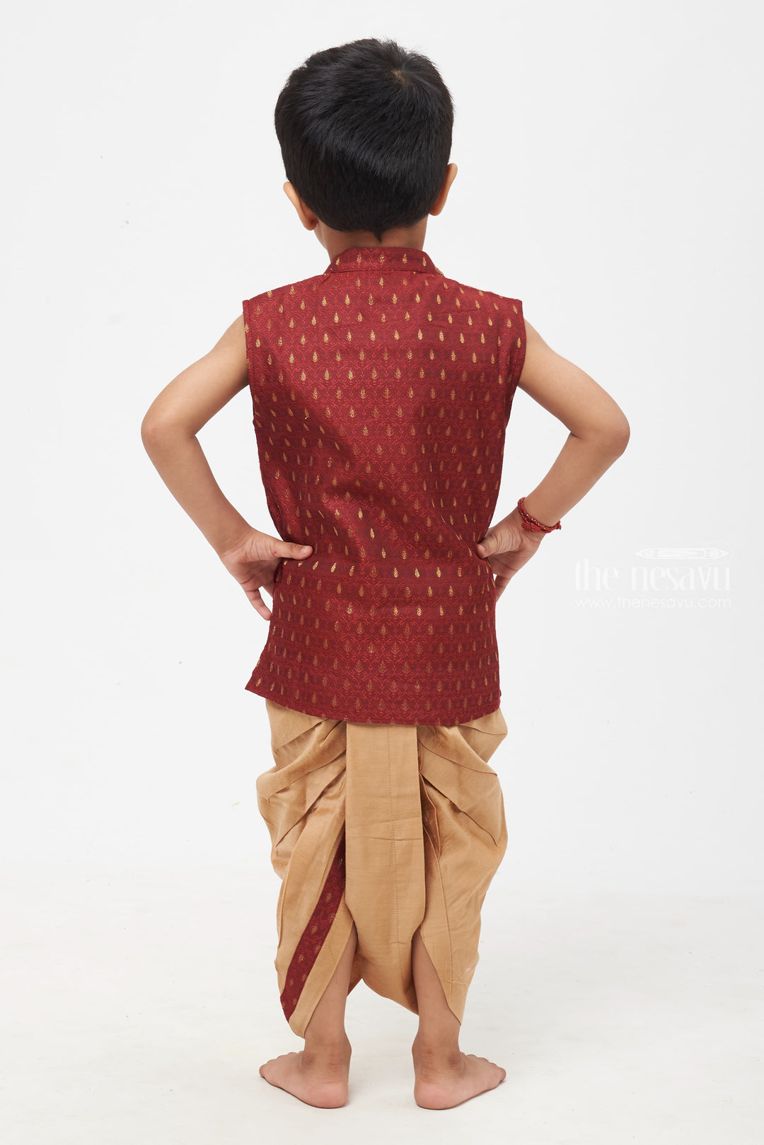 The Nesavu Boys Dothi Set Majestic Maroon Elegance: Boys' Paisley Patterned Vest with Neutral Beige Trousers Nesavu Boys Royal Maroon Kurta with Golden Panchagajam | Timeless Look for Traditional Events | The Nesavu