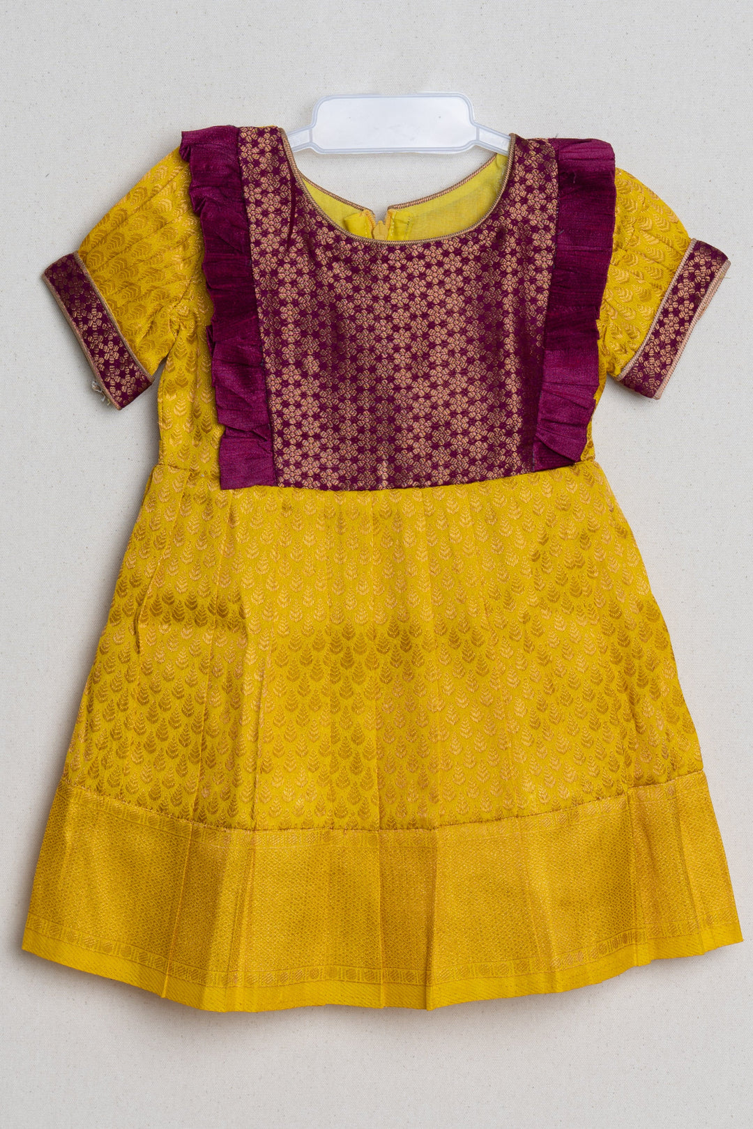 The Nesavu Girls Kanchi Silk Frock Mango Yellow with Deep Purple Semi Banarasi Silk / Pattu Frock For Kids Girls Nesavu 18 (2Y) / Yellow / Self Border SF614C-18 Floral Purple and Yellow Semi-Silk Frock for Girls | Zari with Floral Brocade Designer Purple Yoke | The Nesavu