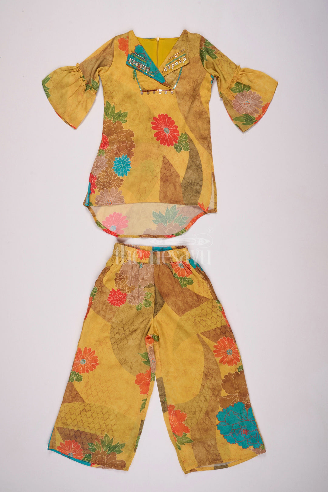 The Nesavu Girls Sharara / Plazo Set Mustard Mercerised Silk Cotton Girls Sharara Set with Bold Floral Print and Embellished Neckline Nesavu 24 (5Y) / Yellow GPS438A-24 Nesavu Mustard Mercerised Silk Cotton Sharara Set Girls Floral Print Sequined Top