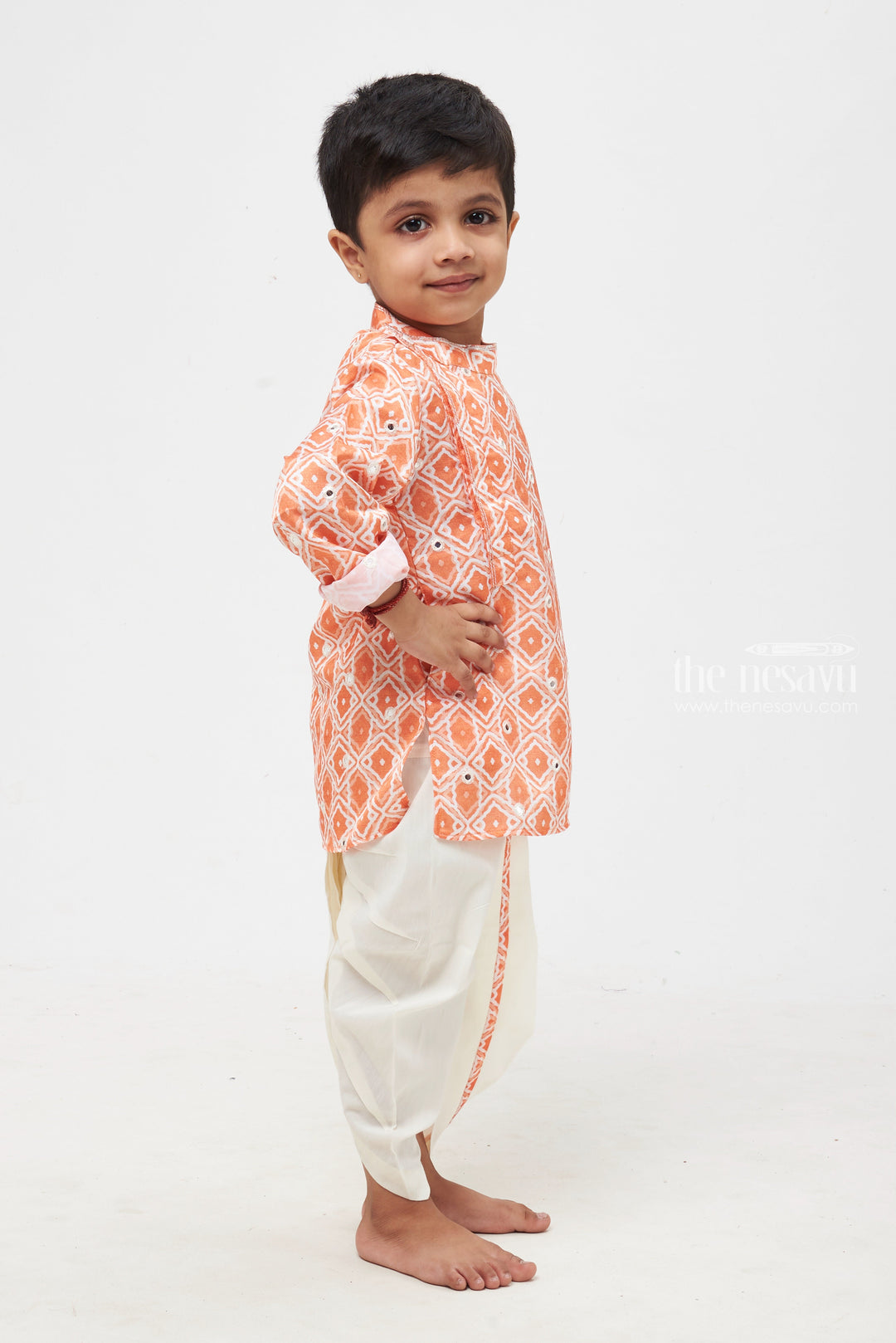 The Nesavu Boys Dothi Set Orange Radiance: Mirror-Embroidered Geometric Printed Kurta & Panjagacham Set for Boys Nesavu Classic Boys Kurta and Dhoti Combo | Timeless Panchagajam Styles | The Nesavu