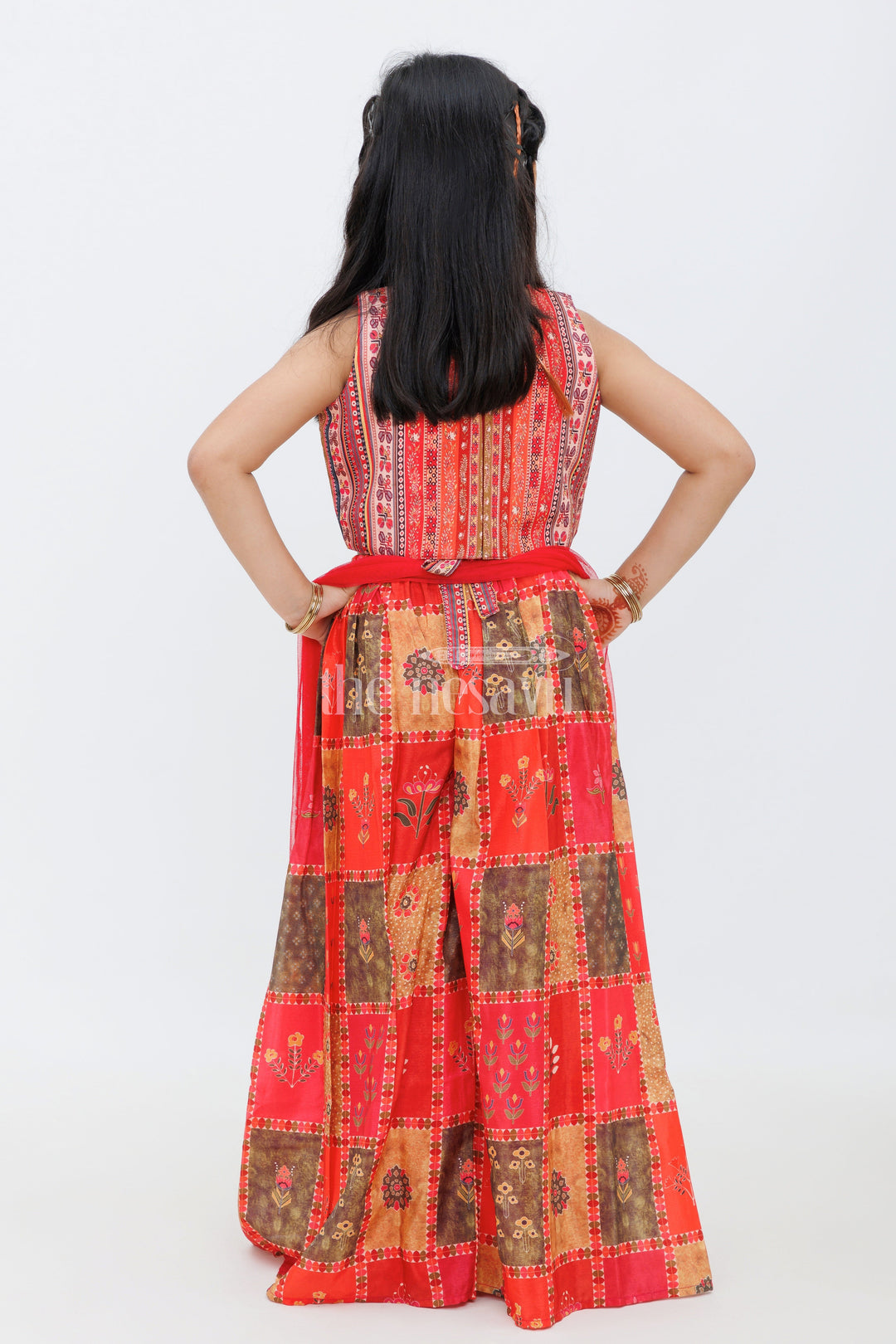 The Nesavu Girls Sharara / Plazo Set Peach Chinon Silk Printed Blouse and Dhoti Set for Girls with Mirror Work and Tassel Detailing Nesavu Peach Chinon Silk Printed Blouse and Dhoti Set for Girls with Mirror Work Nesavu