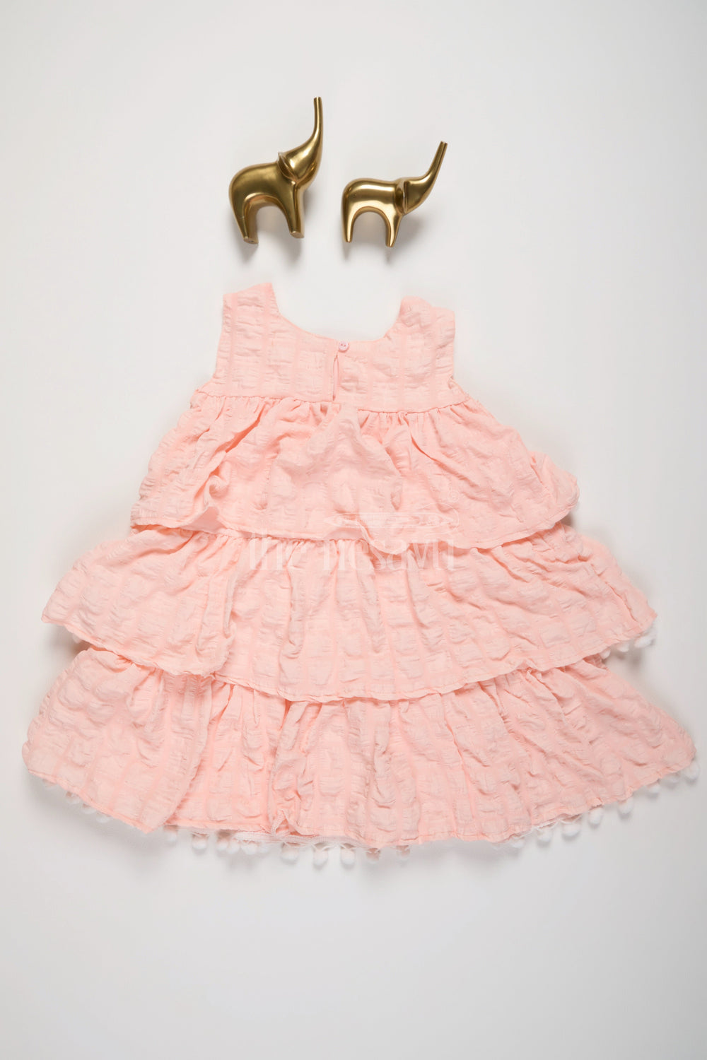 The Nesavu Girls Fancy Frock Peach-Tiered Girls Fancy Frock with White Pom-Pom Trim and Textured Fabric Nesavu Nesavu Peach-Tiered Girls Fancy Frock White Pom-Pom Trim Textured Layers