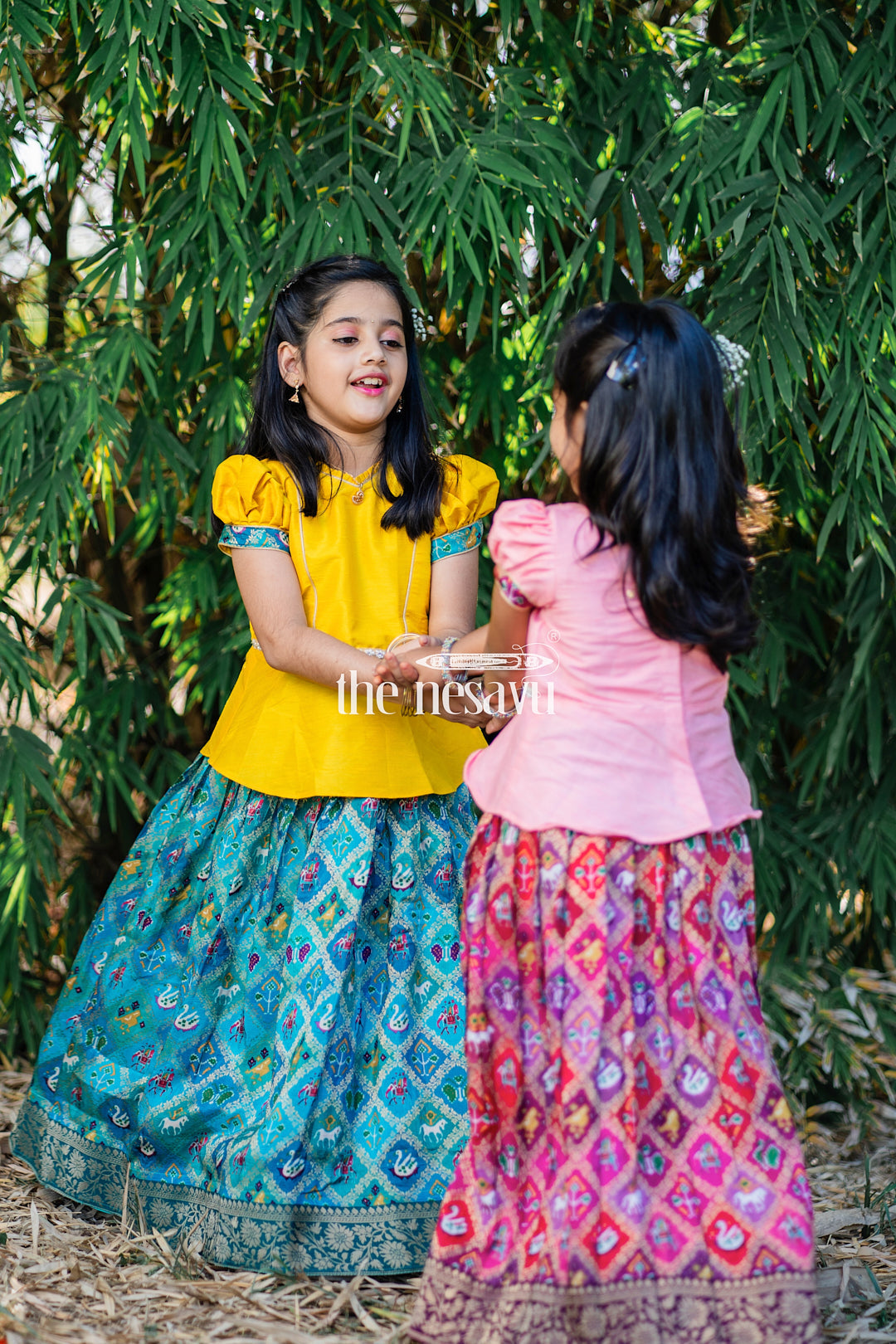 The Nesavu Pattu Pavadai Pink Designer Printed Silk Pattu Pavadai for Girls Nesavu Pink Designer Printed Viscose Silk Pattu Pavadai for Girls - Elegant & Festive