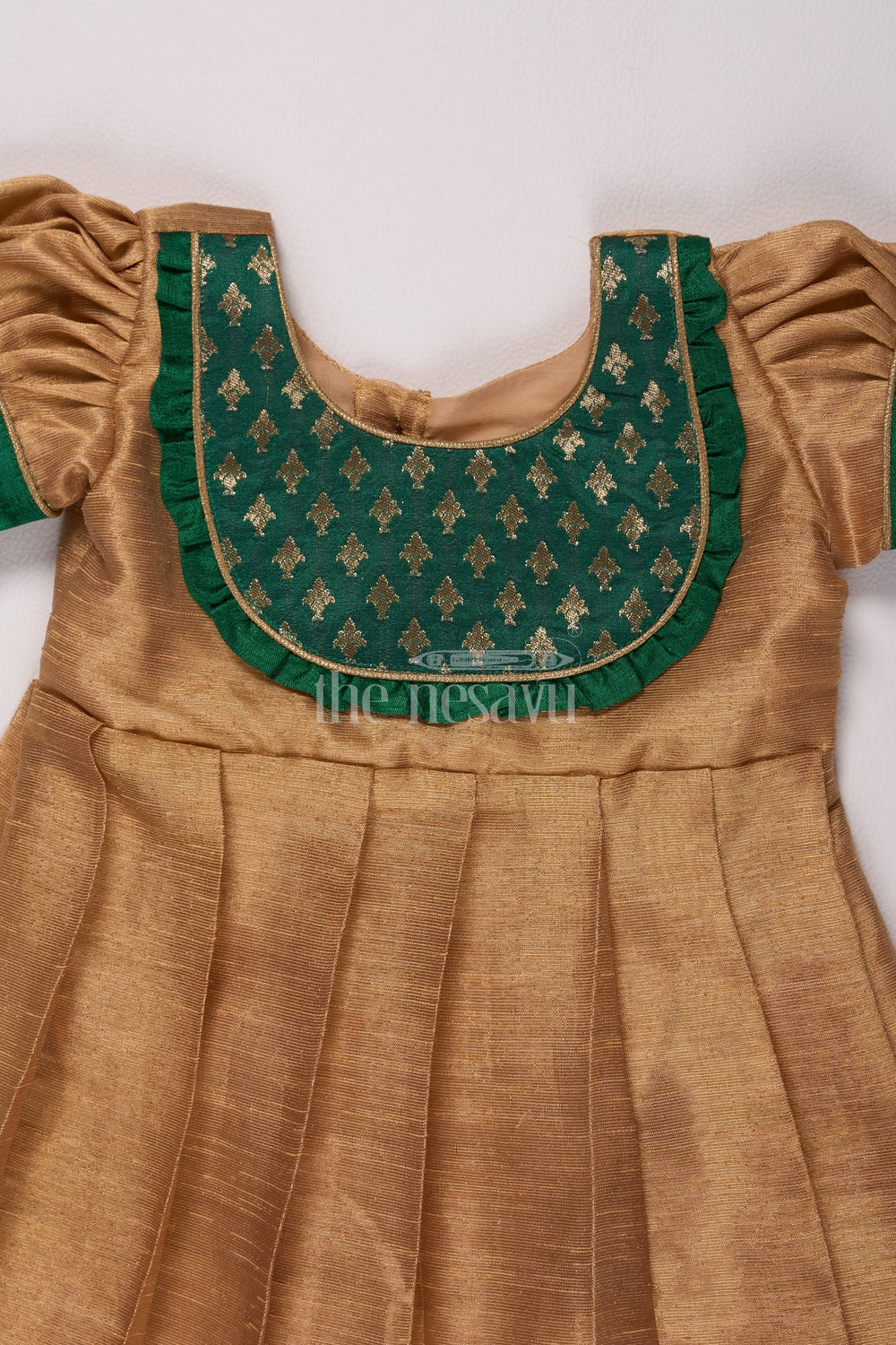 The Nesavu Silk Frock Radiant Gold Long Frock Pattu for Girls with Green Bib Yoke and Silver Tissue Fabric Nesavu Nesavus Gold Long Frock Pattu Girls Silver Tissue Green Yoke