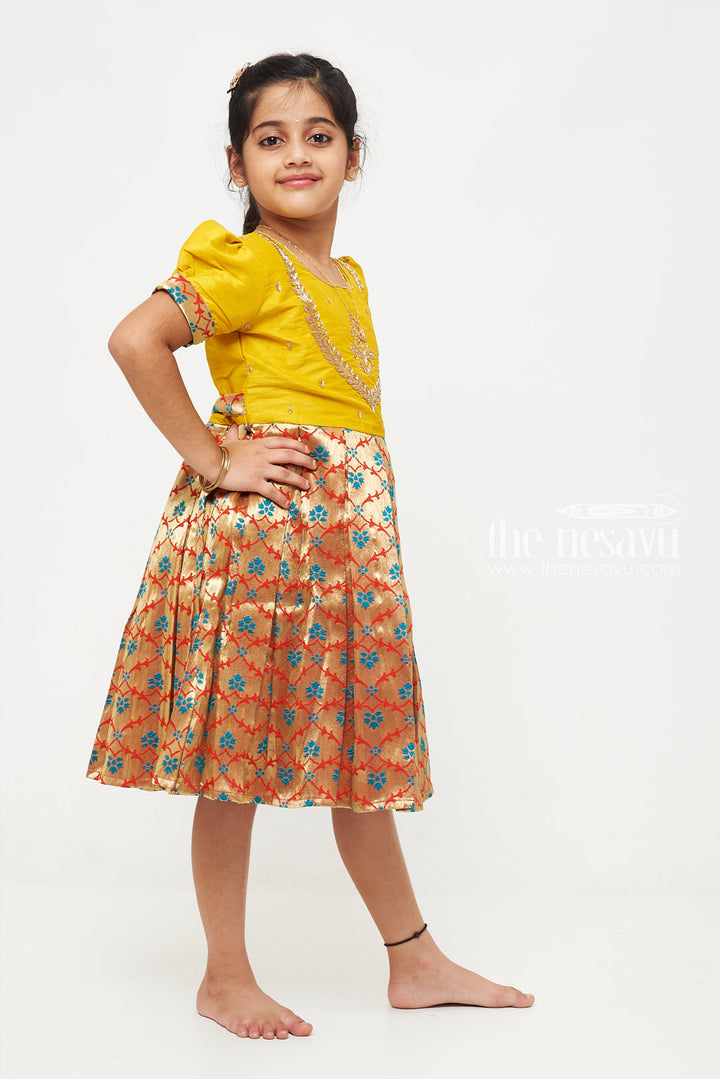 The Nesavu Silk Party Frock Radiant Yellow and Gold Pattu Silk Frock: Exquisite Floral Banarasi Design with Intricate Embroidery for Girls Nesavu Yellow and Gold Pattu Silk Frock | Exquisite Floral Banarasi Design | Festive Wear for Girls | The Nesavu