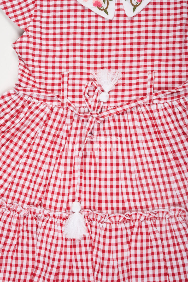 The Nesavu Girls Cotton Frock Red and White Checked Cotton Frock for Girls with Floral Embroidery and Peter Pan Collar Nesavu Red and White Checked Cotton Frock for Girls with Floral Embroidery and Peter Pan Collar Nesavu