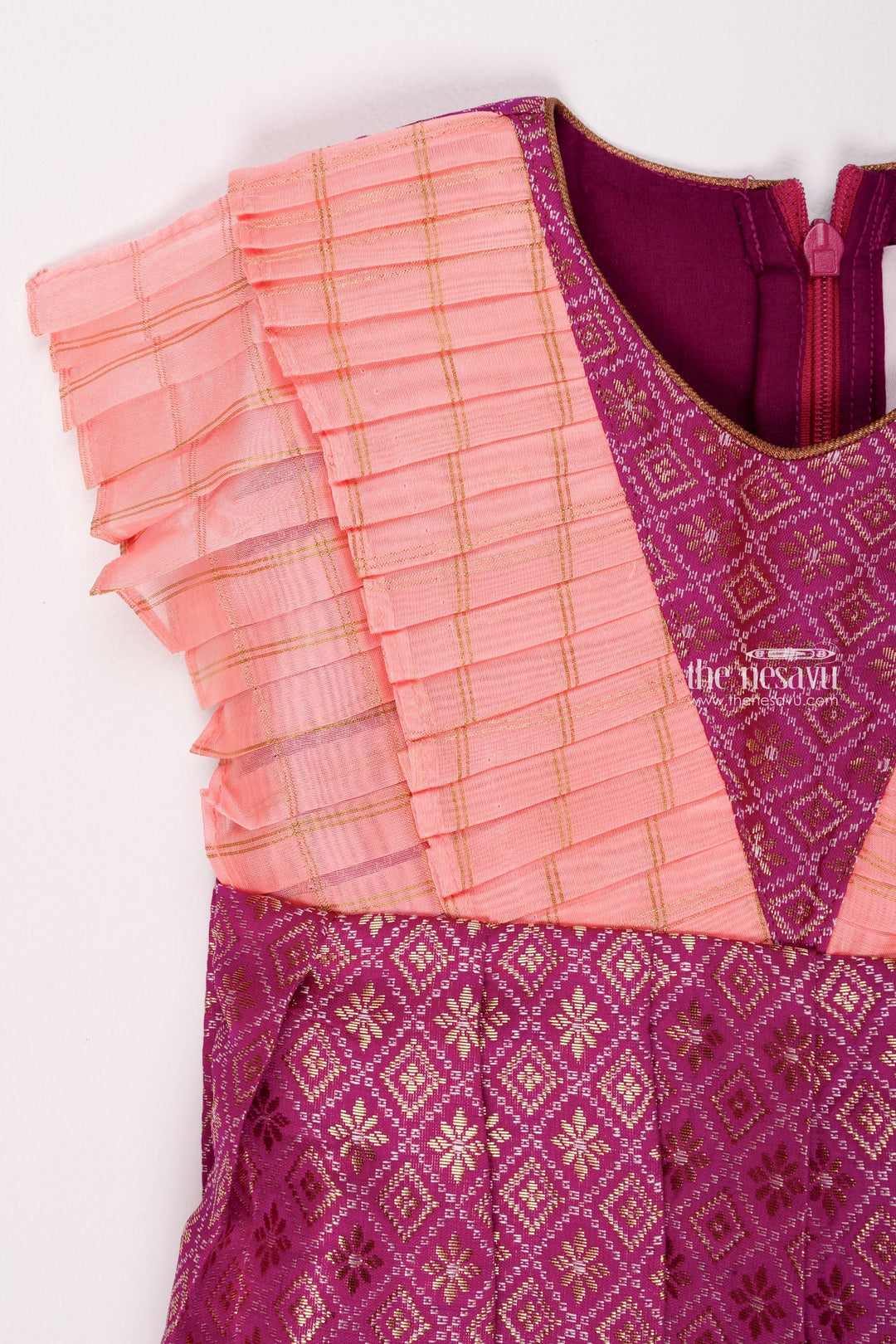 The Nesavu Silk Frock Regal Purple Brocade Elegance Pleated with Salmon Layered Yoke Tradition Meets Modernity for Stylish Girls Nesavu Silk Gown Frock | Silk Pattu Frock Girls | The Nesavu