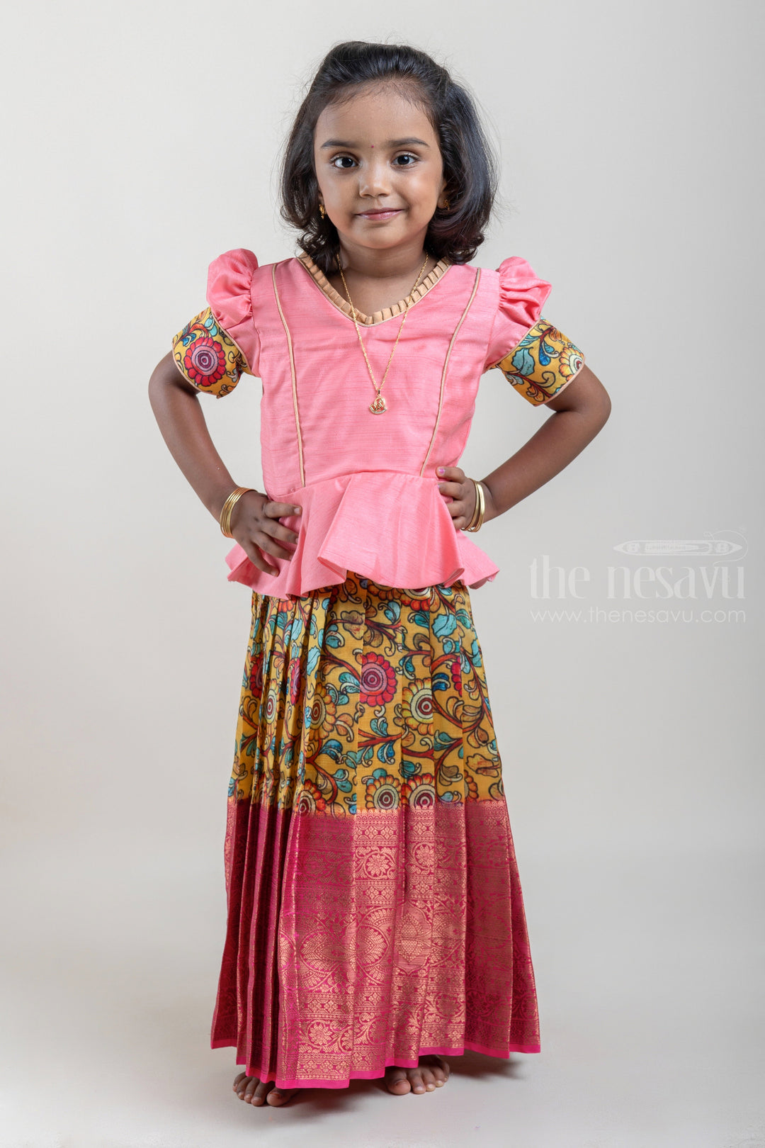 The Nesavu Pattu Pavadai Salmon Pink and Yellow Silk Pattu Pavadai for Girls with Floral Cuffs and Banarasi Border Nesavu Salmon Pink and Yellow Silk Pattu Pavadai for Girls at The Nesavu | Traditional Indian Outfit