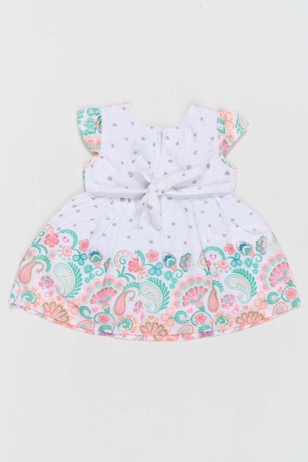 The Nesavu Baby Cotton Frocks Short Frock Cotton for Girls with Vibrant Paisley Prints and Decorative Bow Nesavu Nesavu Short Frock Cotton Girls Paisley Prints Bow Detail  Perfect Family Gatherings