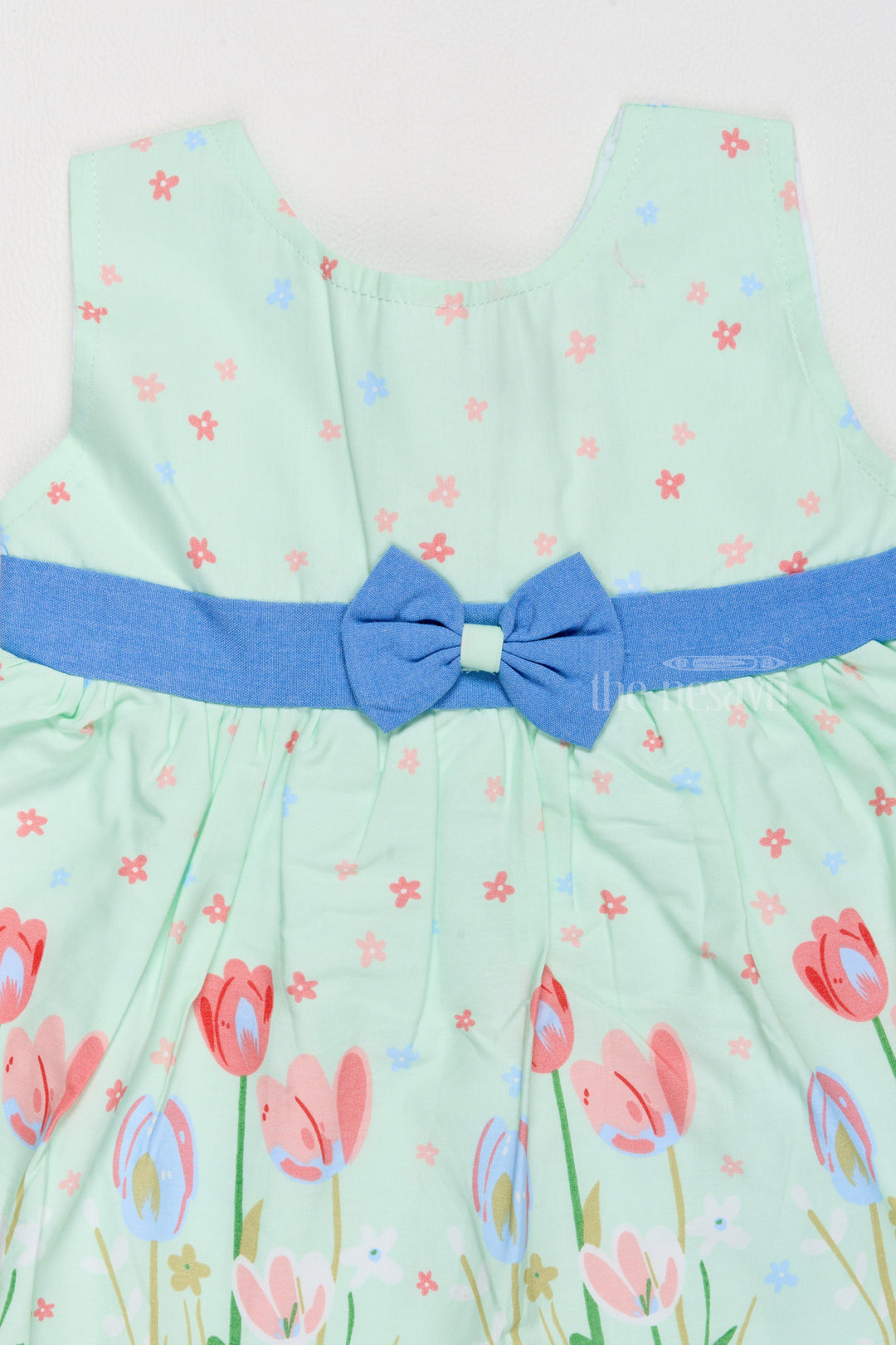 The Nesavu Baby Cotton Frocks Simple Cotton Dress for Girls with Pastel Tulip Prints and Waist Bow Nesavu Nesavu Simple Cotton Girls Dress Pastel Tulip Prints Blue Bow Summer Outings