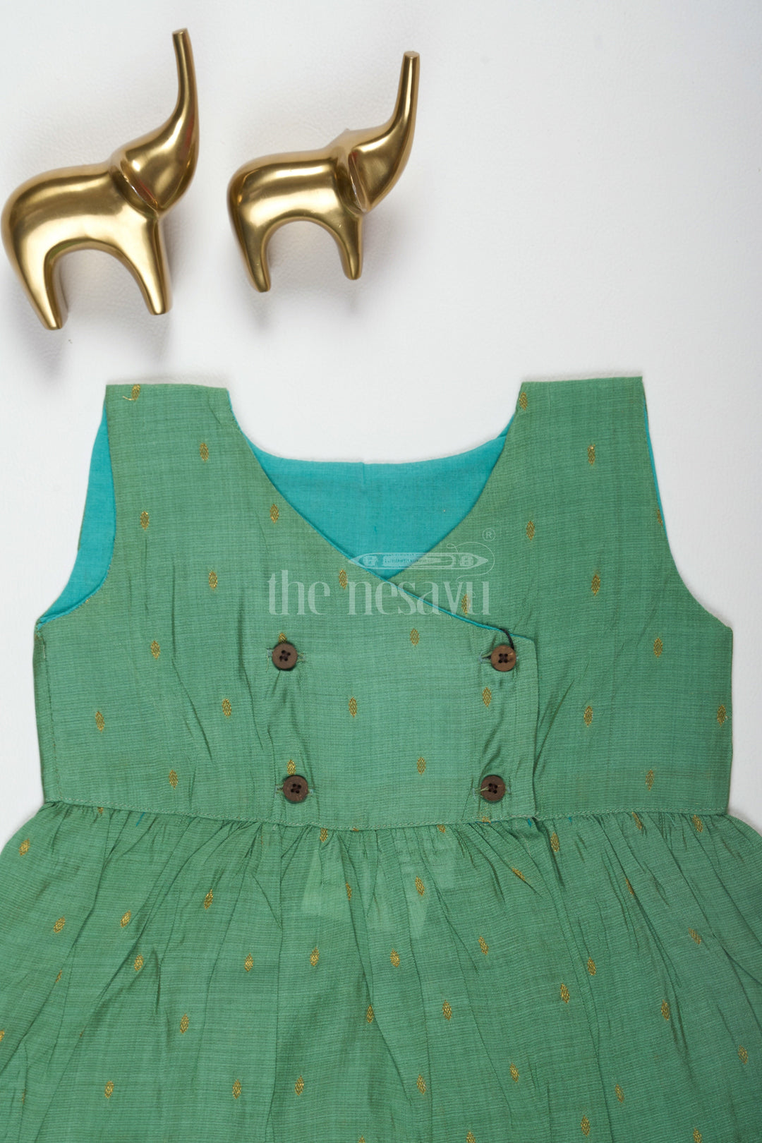 The Nesavu Baby Cotton Frocks Simple Design Rama Green Viscose Silk Frock with Overlap Neckline for Newborns Nesavu Simple Design Rama Green Viscose Silk Frock with Overlap Neckline for Newborns Nesavu