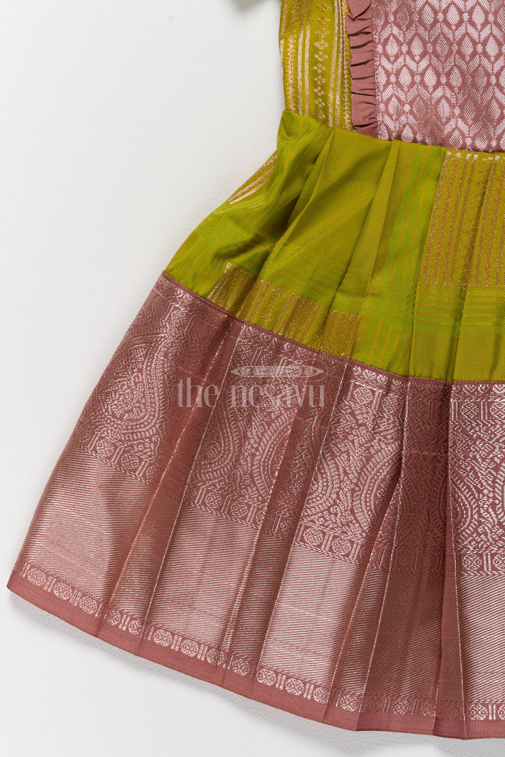 The Nesavu Girls Kanchi Silk Frock Stunning Green and Bronze Long Frock Design Pattu for Girls in Blend Silk Nesavu Nesavus Green Bronze Long Frock Design Pattu Girls Elegant Detailing