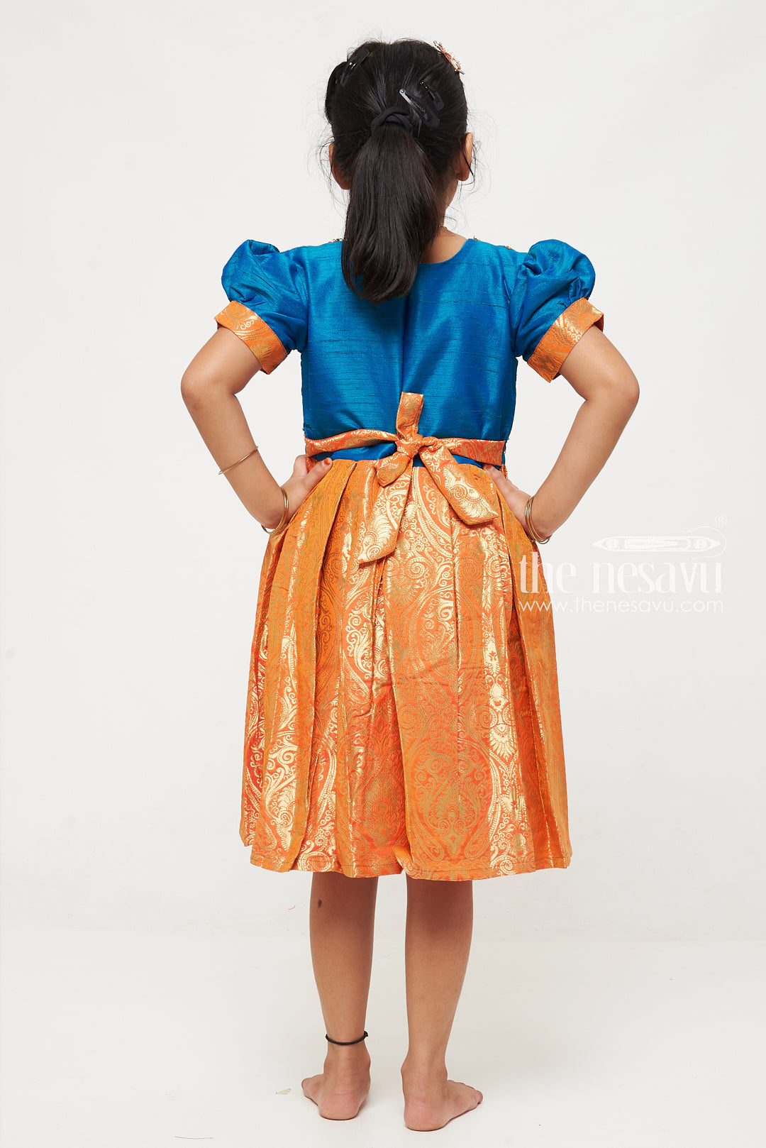 The Nesavu Silk Party Frock Teal and Orange Banarasi Semi-Silk Dress for Girls - Ideal for Festive Occasions Nesavu Teal and Orange Banarasi Semi-Silk Dress for Girls - Festive Wear