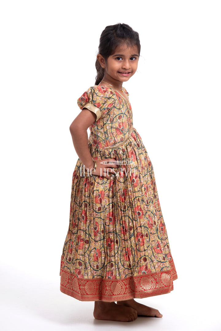 The Nesavu Girls Silk Gown Traditional Yellow Kalamkari Chinon Party Gown for Girls Nesavu Traditional Yellow Kalamkari Chinon Party Gown for Girls - Festive Attire