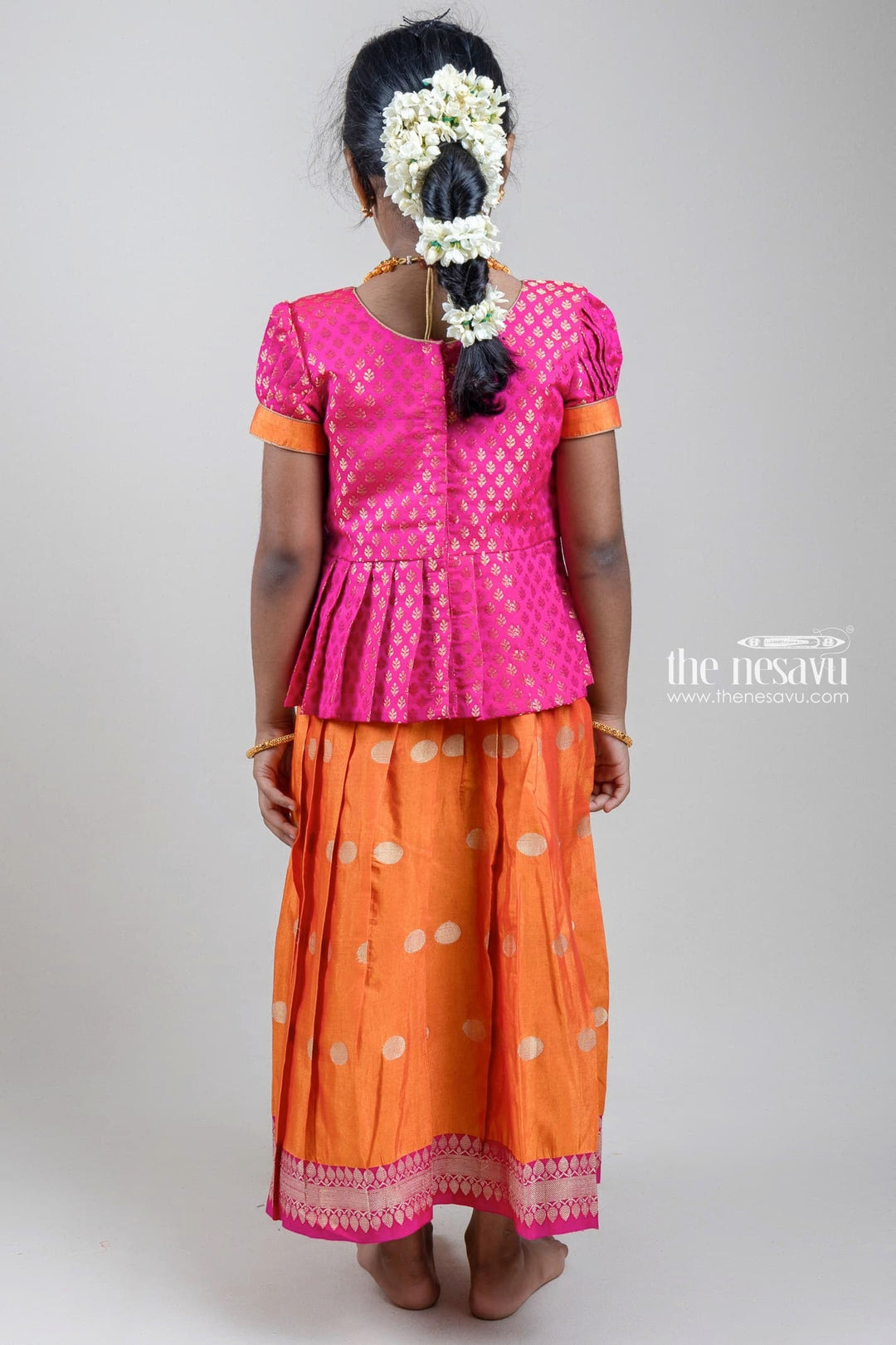 The Nesavu Pattu Pavadai Traditional Zari Brocade Printed Pink Silk Peplum Blouse with Knife Pleated Yellow Silk Skirt for Girls GPP265B Nesavu Zari Brocade Printed Pink Silk Peplum Blouse with Knife Pleated Yellow Silk Skirt for Girls | Shop at The Nesavu