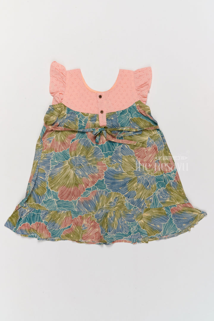 The Nesavu Girls Cotton Frock Trendy Girls Cotton New Dress with Vibrant Leaf Print and Lace Yoke Nesavu Nesavu Girls Cotton New Dress Bold Leaf Print Flutter Sleeves Lace Detailing