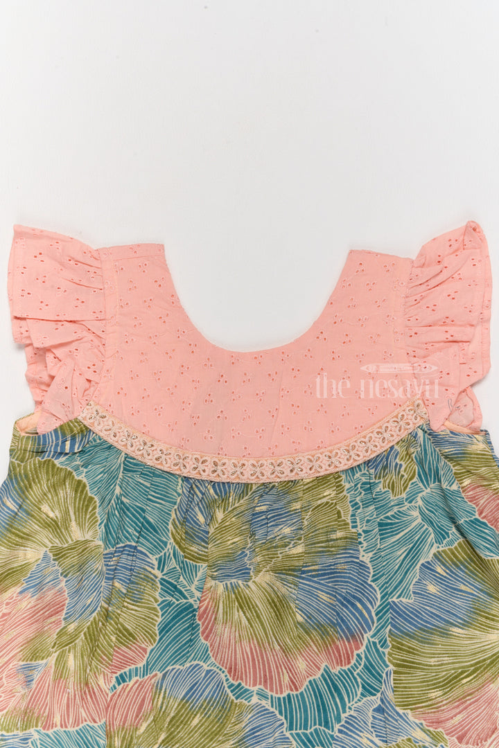 The Nesavu Girls Cotton Frock Trendy Girls Cotton New Dress with Vibrant Leaf Print and Lace Yoke Nesavu Nesavu Girls Cotton New Dress Bold Leaf Print Flutter Sleeves Lace Detailing