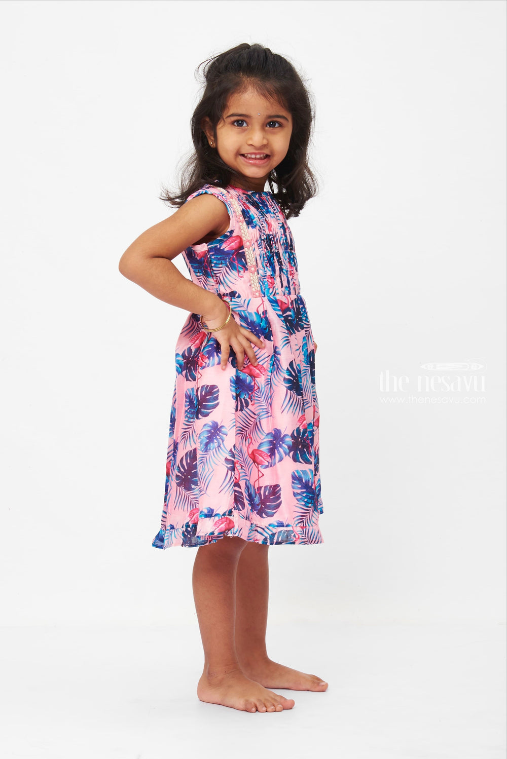 The Nesavu Girls Cotton Frock Tropical Flamingo Fiesta Dress: Playful Pink Frock with Lush Leaf Print for Girls Nesavu Girls Pink Flamingo Tropical Dress | Sleeveless Lace Trim Frock | Summer Party Wear | The Nesavu