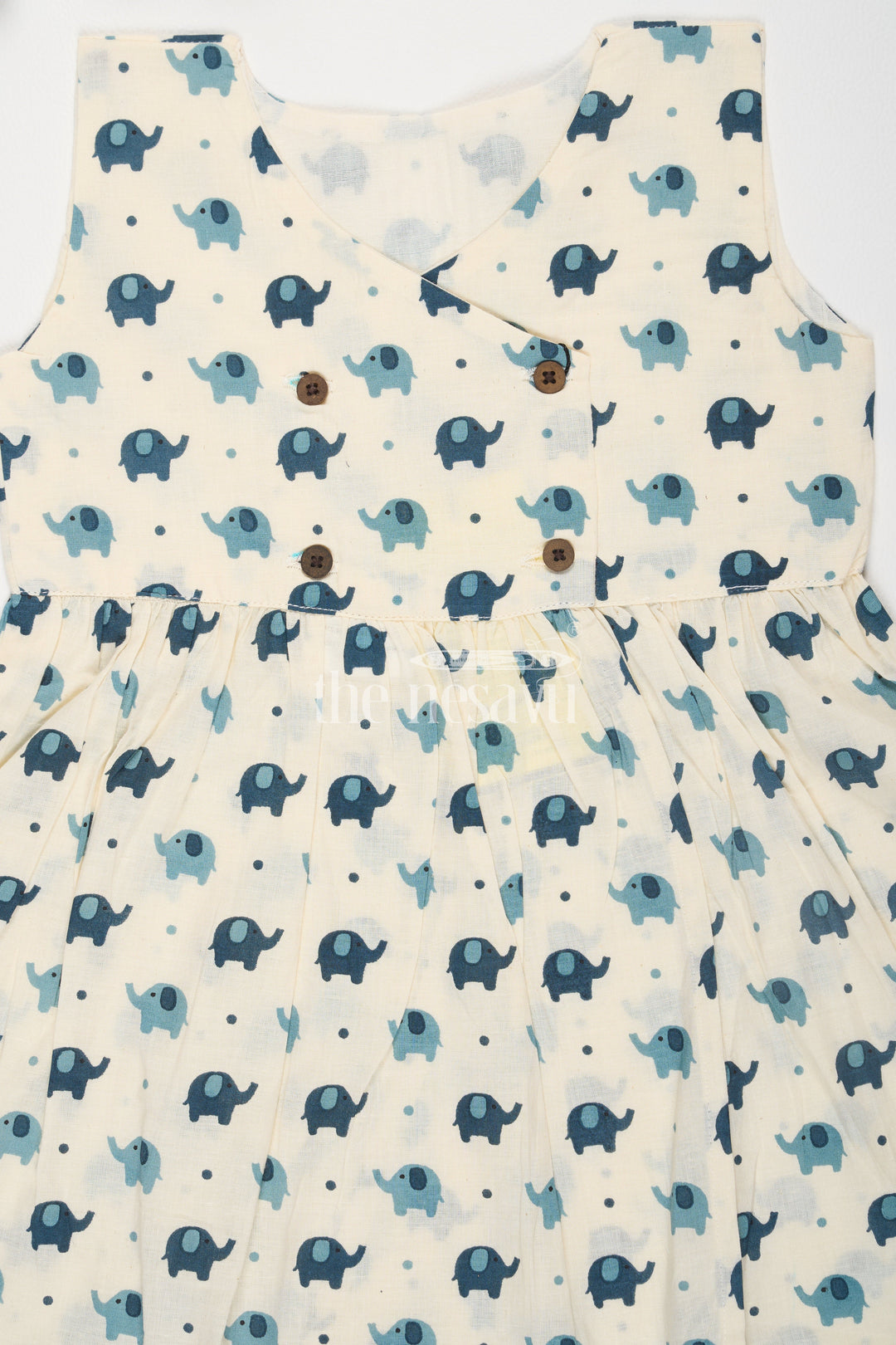 The Nesavu Baby Cotton Frocks Turquoise Elephant Motif Baby Cotton Frock with Mockwrap Neckline and Button Detail Nesavu Turquoise Elephant Motif Baby Cotton Frock with Mockwrap Neckline and Button Detail Nesavu