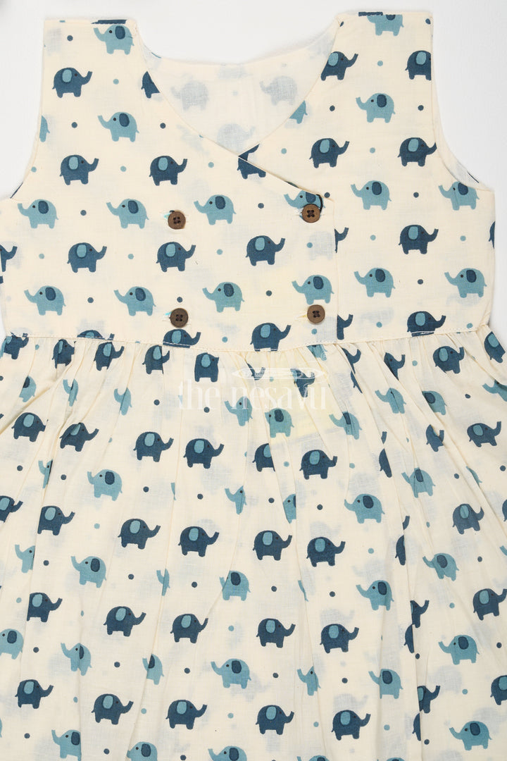 The Nesavu Baby Cotton Frocks Turquoise Elephant Motif Baby Cotton Frock with Mockwrap Neckline and Button Detail Nesavu Turquoise Elephant Motif Baby Cotton Frock with Mockwrap Neckline and Button Detail Nesavu