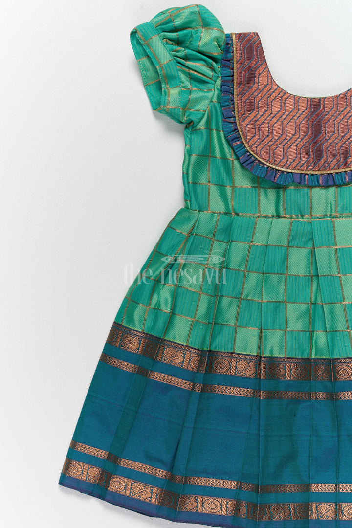 The Nesavu Girls Kanchi Silk Frock Vibrant Green Pattu Long Frock for Girls with Golden Checkered Pattern and Ruffled Yoke Nesavu Nesavus Green Pattu Long Frock Girls Golden Checkered Blend Silk Detailing