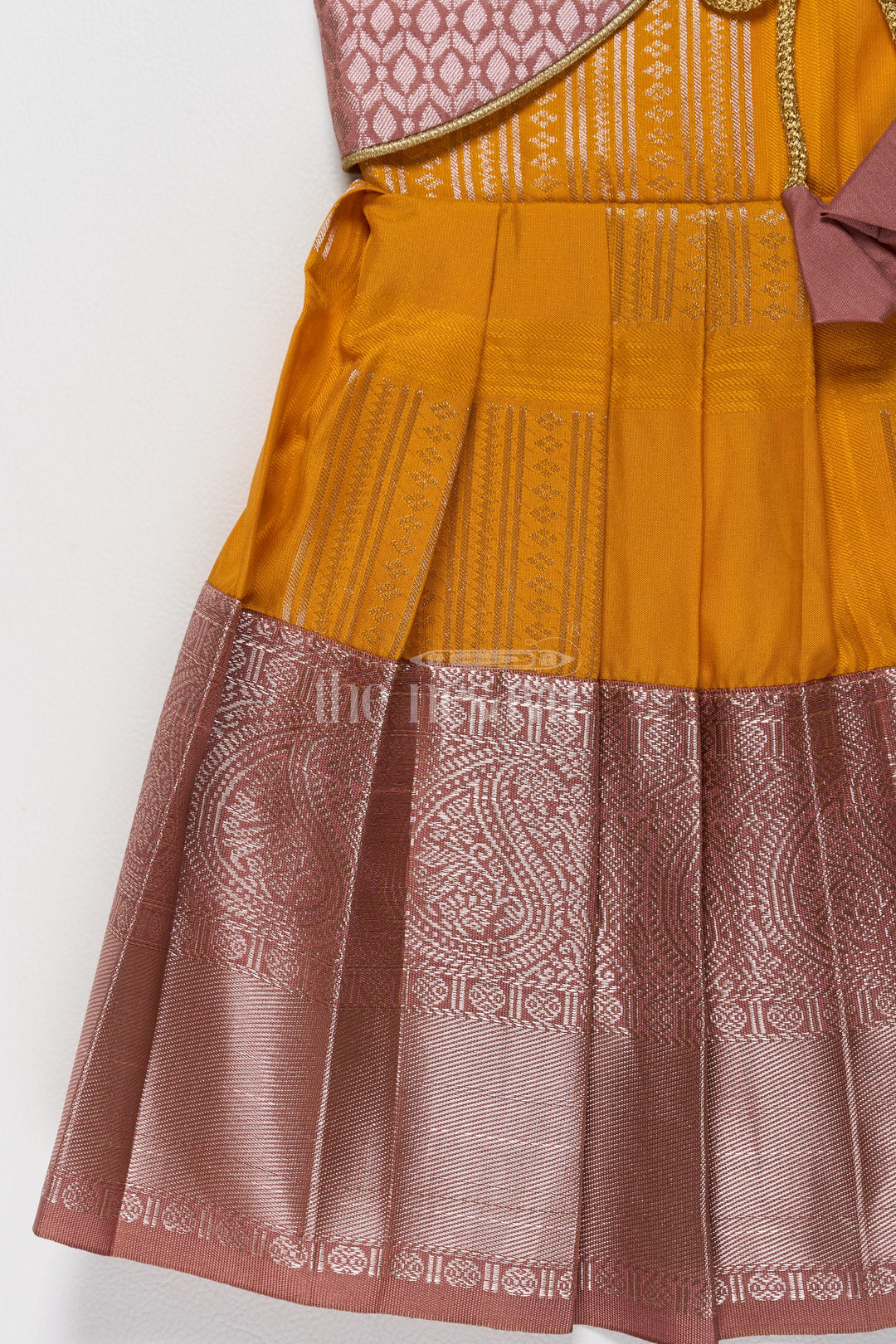 The Nesavu Girls Kanchi Silk Frock Vibrant Yellow and Bronze Long Frock Pattu Designs for Girls in Blend Silk Nesavu Nesavus Yellow Bronze Long Frock Pattu Designs Girls Blend Silk