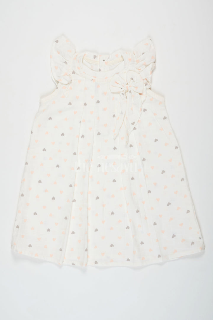 The Nesavu Girls Cotton Frock White Cotton Frock with Heart Print and Ruffle Sleeves, Double Cloth Muslin Girls Dress for Special Occasions Nesavu Nesavu Girls White Cotton Frock Heart Print Ruffle Sleeves Double Cloth Muslin Dress Special Occasions