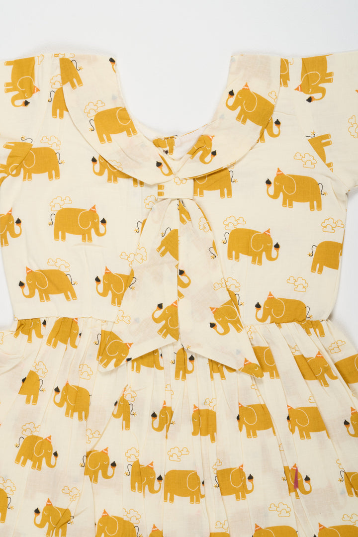 The Nesavu Baby Cotton Frocks Yellow Baby Cotton Frock with Elephant Print and Bow Detail Ideal for Casual Outings Nesavu Nesavu Yellow Pure Cotton Baby Frock Elephant Print Bow Playful Comfortable Kids Outfit