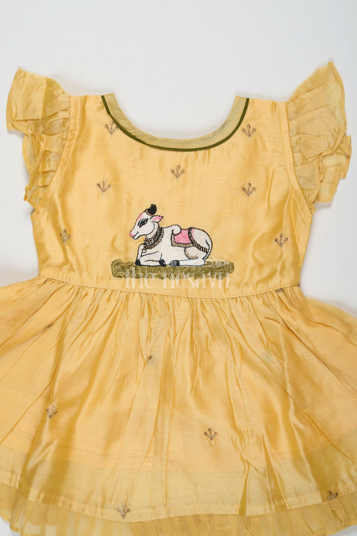 The Nesavu Girls Cotton Frock Yellow Chanderi Cotton Frock with Pichwai Cow Embroidery – Adorable Traditional Attire for Girls Nesavu Yellow Chanderi Cotton Frock Girls Pichwai Cow Embroidery Traditional Festive Wear Nesavu