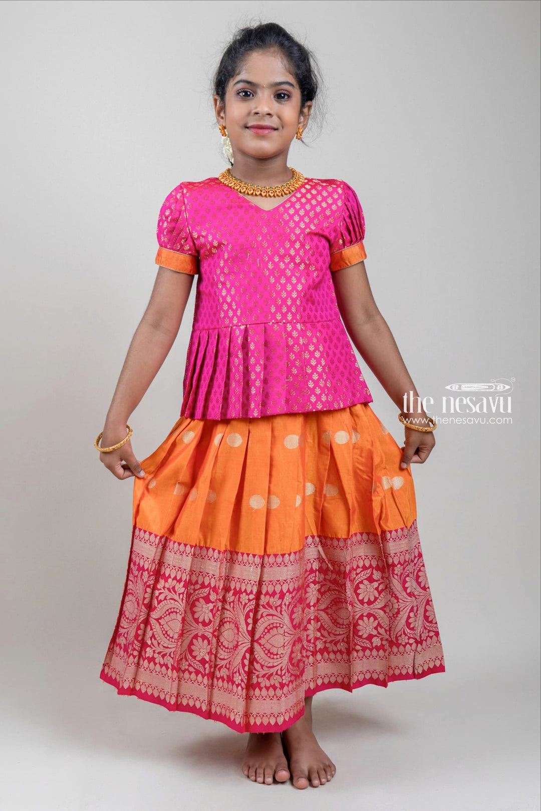 The Nesavu Pattu Pavadai Zari Brocade Printed Pink Silk Peplum Blouse with Knife Pleated Pink Silk Skirt for Girls Nesavu Zari Brocade Printed Pink Silk Peplum Blouse with Knife Pleated Pink Silk Skirt for Girls | Shop at The Nesavu