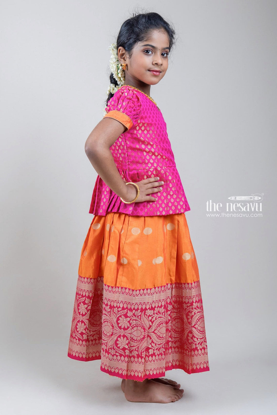 The Nesavu Pattu Pavadai Zari Brocade Printed Pink Silk Peplum Blouse with Knife Pleated Pink Silk Skirt for Girls Nesavu Zari Brocade Printed Pink Silk Peplum Blouse with Knife Pleated Pink Silk Skirt for Girls | Shop at The Nesavu