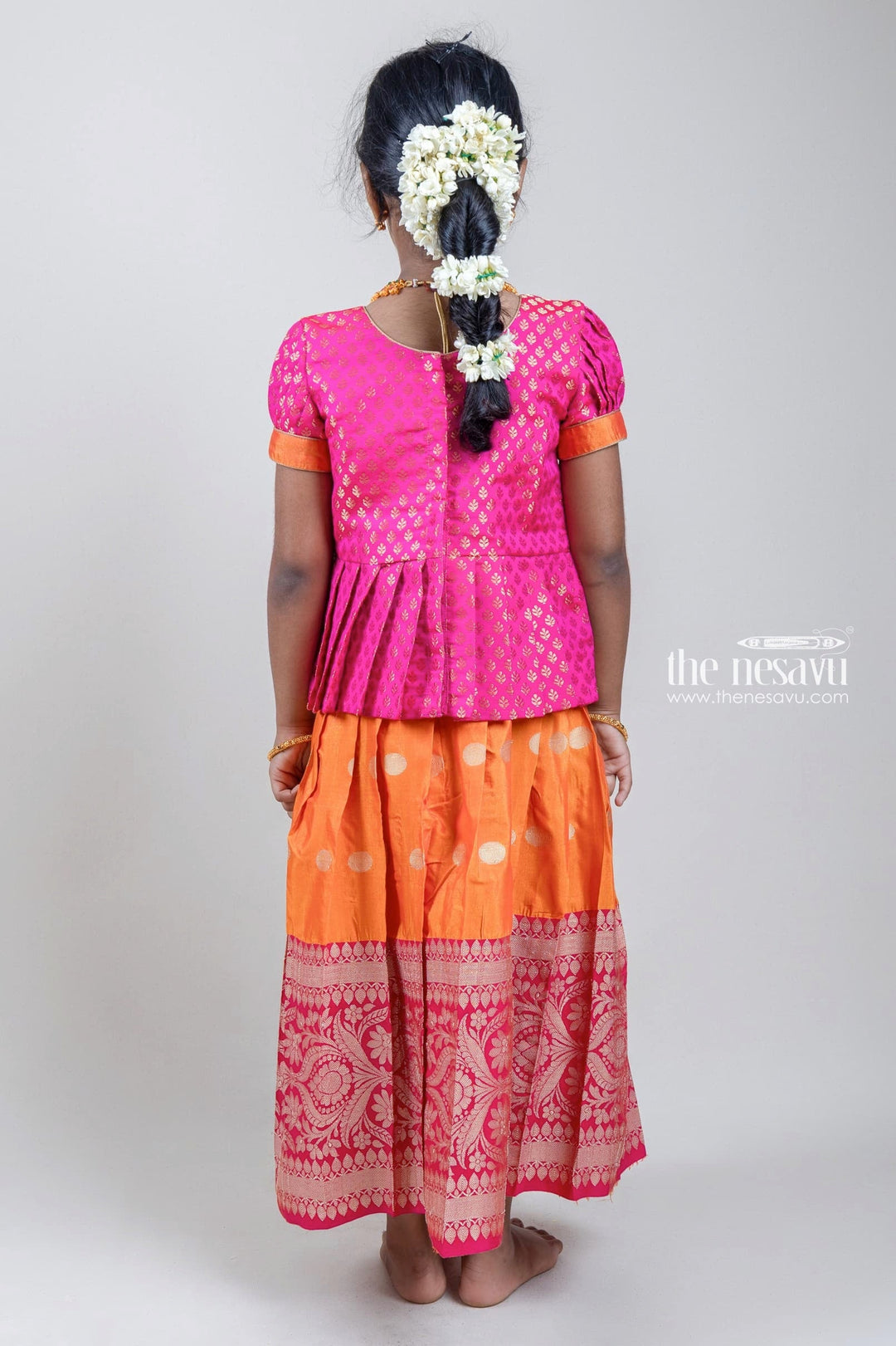 The Nesavu Pattu Pavadai Zari Brocade Printed Pink Silk Peplum Blouse with Knife Pleated Pink Silk Skirt for Girls Nesavu Zari Brocade Printed Pink Silk Peplum Blouse with Knife Pleated Pink Silk Skirt for Girls | Shop at The Nesavu