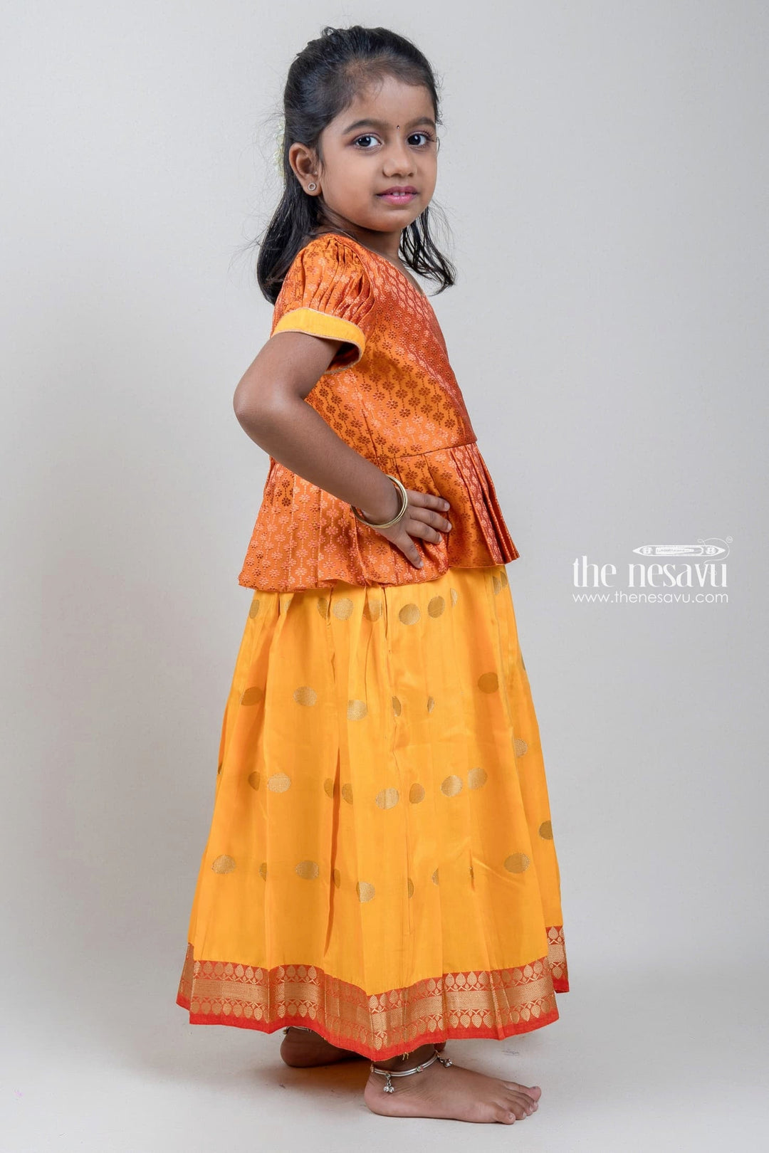 The Nesavu Pattu Pavadai Zari Floral Designer Yellow Silk Peplum Blouse N Knife Pleated Yellow Silk Skirt With Small Border for Girls Nesavu Ethnic Zari Floral Designer Yellow Silk Peplum Blouse with Knife Pleated Yellow Silk Skirt for Girls | Shop at The Nesavu