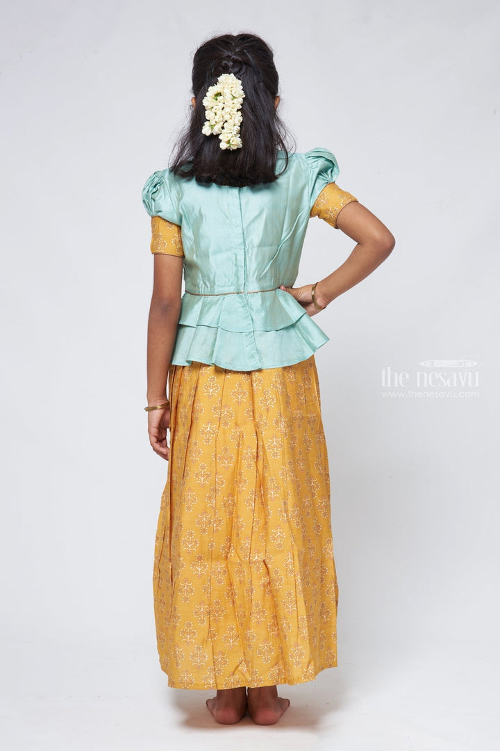 The Nesavu Pattu Pavadai Zari with Floral Printed Yellow Pleated Skirt and Green Jacquard Peplum Blouse Nesavu Latest Style Pattu Pavadai Design | Silk Readymade Dress for Girls | The Nesavu